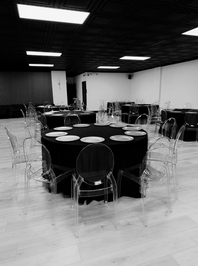 The Nova Loft main room with ghost chairs and round tables
